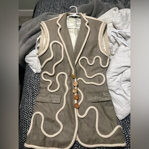 Stylish Beige Sleeveless Jacket with Button Detail